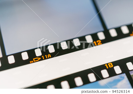 Perforations on developed reversal film Perforations on developed reversal film 94526314