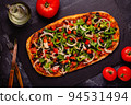 Homemade vegan pizza with tomatoes, peppers, olives, onions and herbs. 94531494