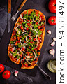 Homemade vegan pizza with tomatoes, peppers, olives, onions and herbs. 94531497