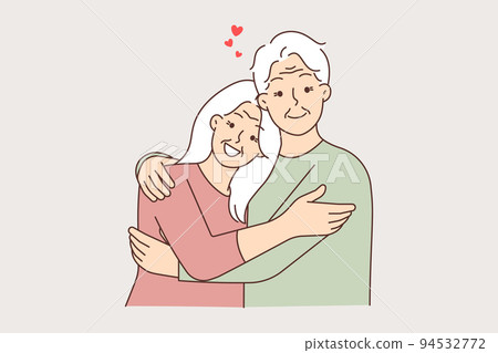 Happy elderly couple hugging Happy elderly couple hugging 94532772