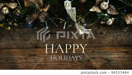Happy holidays text and Christmas decoration 94533464