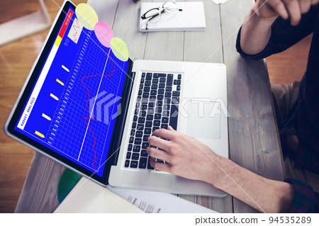 Hands of caucasian businessman sitting at desk using laptop with statistical data on screen Hands of caucasian businessman sitting at desk using laptop with statistical data on screen 94535289