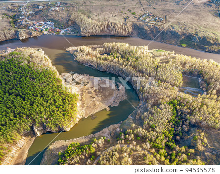 Confluence of the Iset and Kamenka rivers in the city Kamensk-Uralskiy. Iset and Kamenka rivers, Kamensk-Uralskiy, Sverdlovsk region, Ural mountains, Russia. Aerial view 94535578