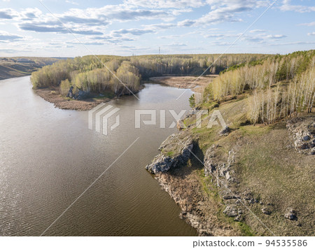 Confluence of the Iset and Kamenka rivers in the city Kamensk-Uralskiy. Iset and Kamenka rivers, Kamensk-Uralskiy, Sverdlovsk region, Ural mountains, Russia. Aerial view 94535586
