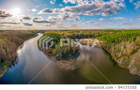 Confluence of the Iset and Kamenka rivers in the city Kamensk-Uralskiy. Iset and Kamenka rivers, Kamensk-Uralskiy, Sverdlovsk region, Ural mountains, Russia. Aerial view 94535588