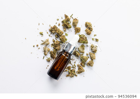 Image of bottle of cbd oil on white surface Image of bottle of cbd oil on white surface 94536094