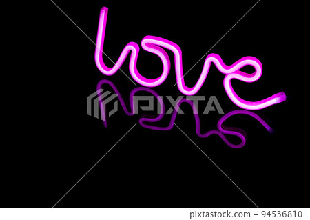 Image of vibrant neon love text formed with pink glow sticks over black background and copy space Image of vibrant neon love text formed with pink glow sticks over black background and copy space 94536810