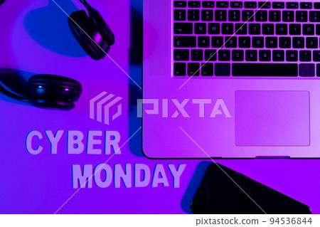 Image of cyber monday text, smartphone, laptop and headphones over neon purple background Image of cyber monday text, smartphone, laptop and headphones over neon purple background 94536844