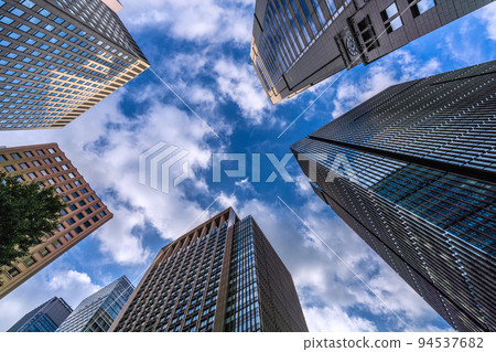 The cityscape of Tokyo, Japan: Dark clouds loom over Otemachi. After the typhoon passed, it was sunny for a short while, but it was soon covered with dark clouds = September 21 94537682