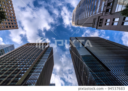 The cityscape of Tokyo, Japan: Dark clouds loom over Otemachi. After the typhoon passed, it was sunny for a short while, but it was soon covered with dark clouds = September 21 94537683