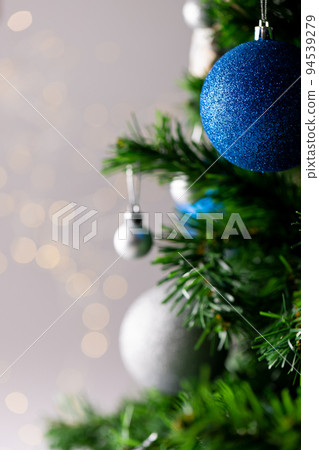 Image of christmas tree with baubles decoration and copy space on grey background Image of christmas tree with baubles decoration and copy space on grey background 94539279