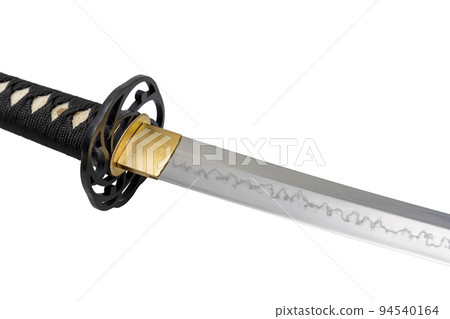 The 'habaki' - collar is made of polished brass. It is at the base of a Japanese sword blade with a wavy pattern on the sharp part. isolated on a white background. Selective focus. The 'habaki' - collar is made of polished brass. It is at the base of a Japanese sword blade with a wavy pattern on the sharp part. isolated on a white background. Selective focus. 94540164
