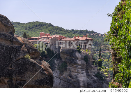 The Holy Varlaam Monastery is visible in crevice of neighboring rocks 94540902