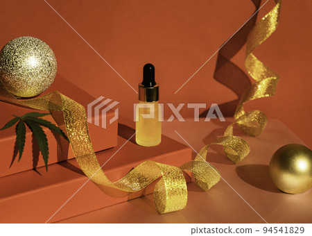 Red podium of gift boxes golden ribbon. Christmas background with podium for cannabis products. cbd oil. Red podium of gift boxes golden ribbon. Christmas background with podium for cannabis products. cbd oil. 94541829