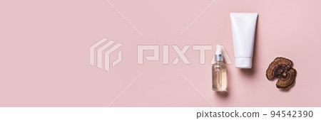 Cosmetic beauty products with mushrooms on pink banner. Mushroom skincare concept Cosmetic beauty products with mushrooms on pink banner. Mushroom skincare concept 94542390