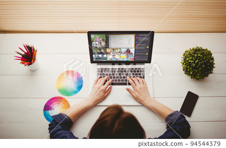 Caucasian woman using laptop for video call, with smiling diverse elementary school pupils on screen Caucasian woman using laptop for video call, with smiling diverse elementary school pupils on screen 94544379