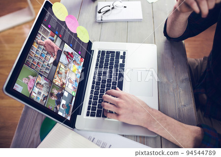 Hands of man using laptop for video call, with smiling diverse elementary school pupils on screen Hands of man using laptop for video call, with smiling diverse elementary school pupils on screen 94544789