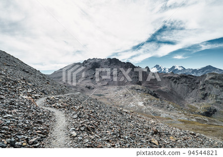 Trail through stony terrain in the Swiss mountains 94544821