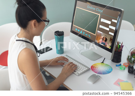 Caucasian girl using computer for video call, with smiling female teacher on screen Caucasian girl using computer for video call, with smiling female teacher on screen 94545366