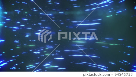 Image of blue and green light trails spinning against black background 94545733
