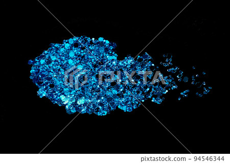 Blue glitter makeup product smear on black. Eye shadow, lip gloss and face for holiday makeup swatch 94546344
