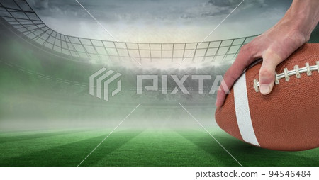 Composition of male rugby player holding rugby ball over sports stadium 94546484