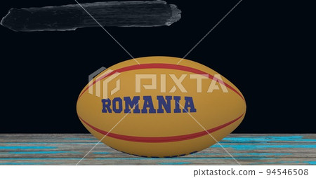 Composition of rugby ball decorated with text romania on black background 94546508