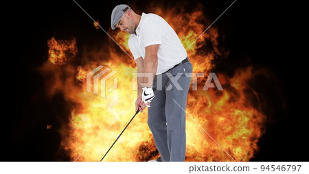 Composition of male golf player over flames on black background Composition of male golf player over flames on black background 94546797