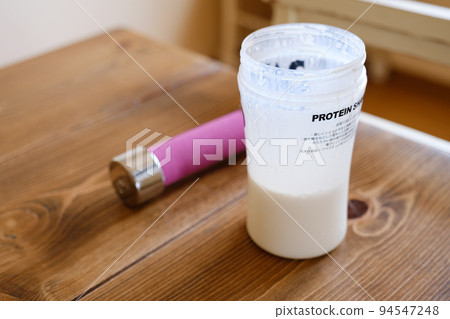 Protein drinks and dumbbells Protein drinks and dumbbells 94547248