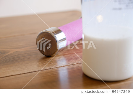 Protein drinks and dumbbells 94547249