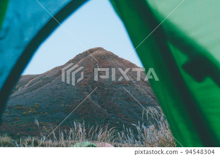 The morning after mountain climbing camp, looking at the mountain ahead from inside the tent The morning after mountain climbing camp, looking at the mountain ahead from inside the tent 94548304
