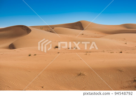 Sahara desert dunes and clear blue sky Sahara desert dunes and clear blue sky 94548792