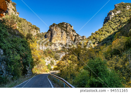Driving through Foz de Arbayun canyon of Salazar River in the Pyrenees in Spain 94551165