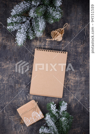 Christmas composition with empty craft notebook 94551589