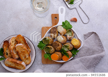 Baked snails Escargot with bread Baked snails Escargot with bread 94551686