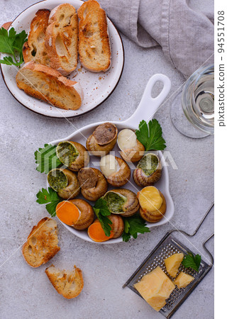 Baked snails Escargot with bread Baked snails Escargot with bread 94551708