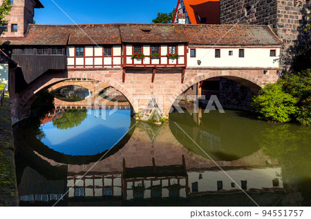 Old stone bridge in Nuremberg, Franconia, Germany. Old stone bridge in Nuremberg, Franconia, Germany. 94551757