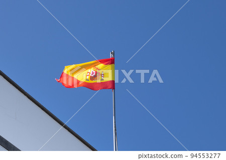 Spanish flag blowing in the wind 94553277