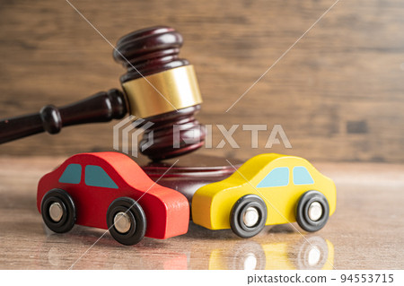 Hammer gavel judge with car vehicle accident, insurance coverage claim lawsuit court case. 94553715