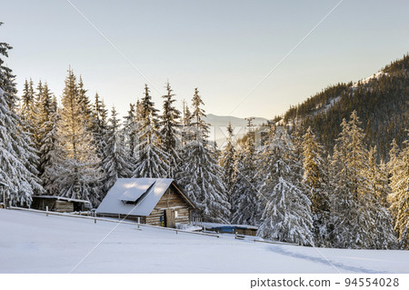 Panorama of winter mountains with houses of shepherds. Carpathians, Ukraine, Europe. Fantastic winter landscape. Creative collage. Beauty world. 94554028