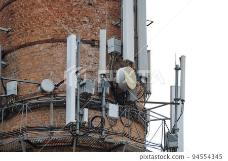 Closeup and detailed view of various GPS, cellphone, 3G, 4G and 5G equipped telecommunication tower 94554345