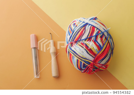 top view of multi color yarn on color background top view of multi color yarn on color background 94554382