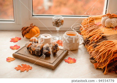 Homemade cake on a white background near the window close-up and copy space 94554779