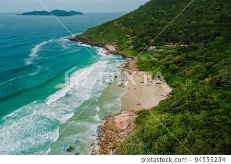Coastline with beach, mountains and ocean with waves in Brazil. Aerial view of Saquinho beach 94555234