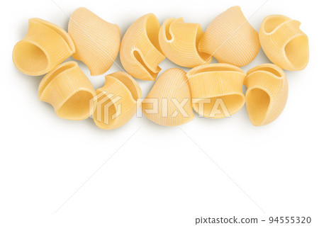 lumaconi pasta isolated on white background with full depth of field. Top view with copy space for your text. Flat lay lumaconi pasta isolated on white background with full depth of field. Top view with copy space for your text. Flat lay 94555320