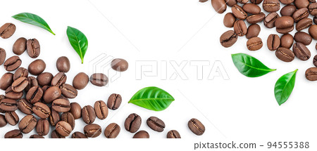 Heap of roasted coffee beans with leaves isolated on white background with copy space for your text. Top view. Flat lay. 94555388