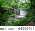 A waterfall deep in the mountains Kitanizawa stream 94555704