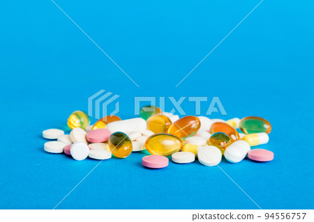Many different colorful medication and pills perspective view. Set of many pills on colored background Many different colorful medication and pills perspective view. Set of many pills on colored background 94556757