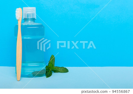 Mouthwash and fresh mint on colored background, top view with copy space for text 94556867