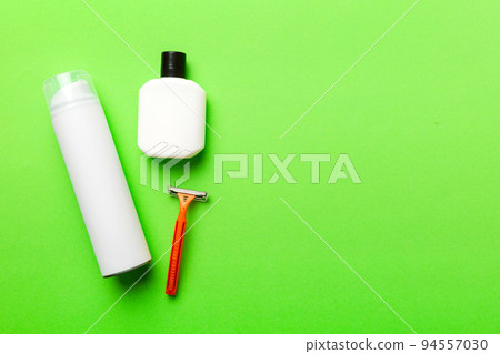 shaving man set. shaving machine, towel, lotion and shaving foam on colored background. Men bath Accessories top view 94557030
